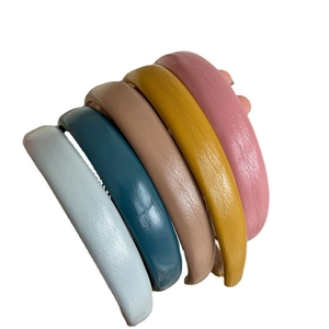 Set of five colorful padded faux leather headbands in pastel tones for women