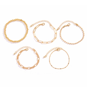 Detailed set of 5 golden bracelets including bead, paperclip and delicate link chains