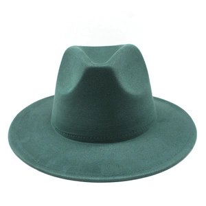 Macro view of stitching details and texture on a dark green felt fedora hat
