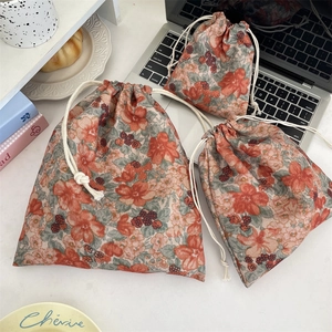 Three-piece floral cotton drawstring storage bags in various sizes for travel and makeup