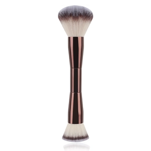 Dual-ended makeup brush with fluffy powder head and flat foundation brush on white background