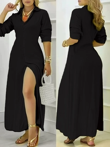 Dettaglio dell'elegante abito a camicia nera a maniche lunghe con spacco laterale alto e colletto