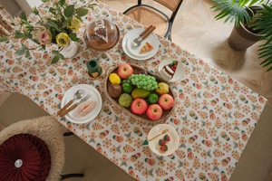 Macro view of gingerbread man pattern on rustic linen Christmas tablecloth fabric