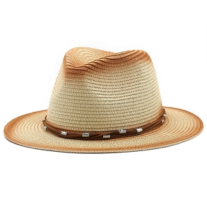 Detail of Panama hat straw weave texture with brown ombré brim and leather cord band