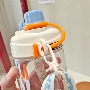 Detail of portable kids straw cup featuring blue cap and adjustable HAPPY strap