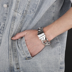 Detailed view of silver stainless steel thick chain bracelet with secure plug buckle