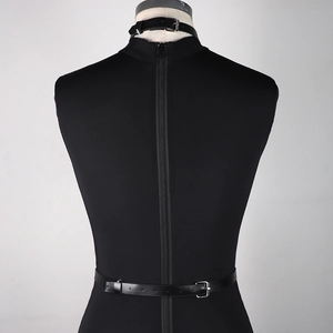 Detailed back view of a black faux leather bodysuit featuring a collar and visible zipper