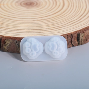 Detailed view of dual-cavity silicone mold featuring cute cat and bear paw shapes