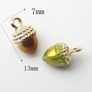 Miniature acorn charms in brown and green resin with gold tops, size 7mm by 13mm