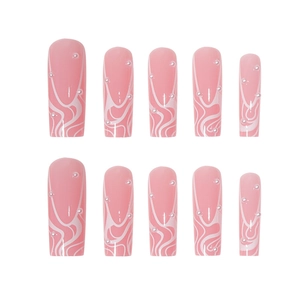 Long pink press-on nails with white wave lines and pearl accents on a white background