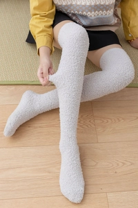 Detail of light grey coral fleece over-knee socks showing soft texture and high elasticity