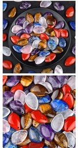 Macro detail of various teardrop natural stone pendants with smooth polished textures