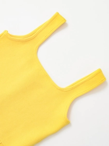 Close-up of bright yellow knitted vest showing detailed texture and strap craftsmanship