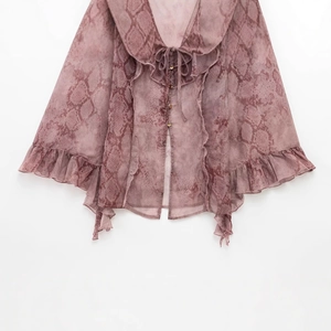 Women's snake print chiffon blouse with tie neck and ruffle trim in dusty rose pink