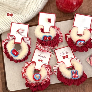 Detailed set of red plush polka dot hair scrunchies with cute cherry and bear charms