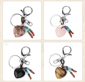 Detailed set of four heart-shaped natural stone keychains with colorful chakra beads