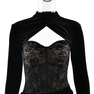 Detail of black velvet and lace patchwork corset top with sheer hollow design
