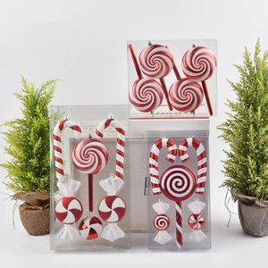 Red and white Christmas candy cane ornaments with glitter finish in transparent boxes