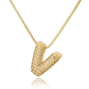 Macro detail of gold capital letter V pendant with cubic zirconia on a box chain