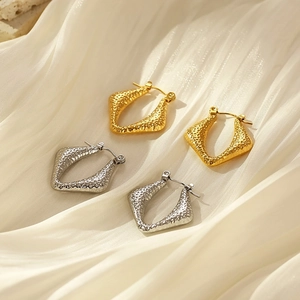 Textured geometric stainless steel hoop earrings in gold and silver finish