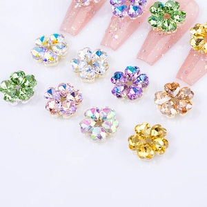 Colorful 3D heart-shaped crystal flower nail charms with pink glitter nail art display