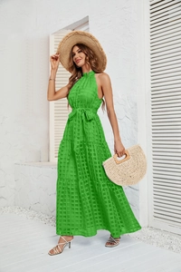 Detail of green halter maxi dress featuring layered ruffles and textured grid pattern