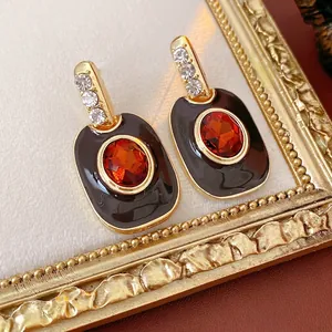 Vintage enamel and orange zircon oval stud earrings with gold filigree and crystals