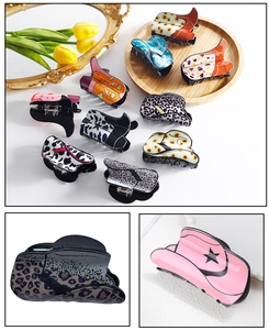Detail shots of acrylic hair clips in trendy cowboy boot shapes with various patterns