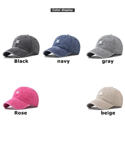 Collage of washed cotton baseball caps with M embroidery in five diverse colors