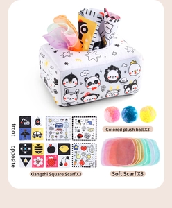 Detail view of baby sensory tissue box toy with fabric scarves and plush colorful balls