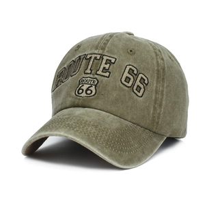 Detailed embroidery of the Route 66 shield logo on army green washed cotton baseball cap