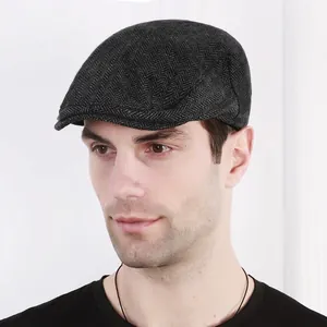 Men's herringbone newsboy cap in black and grey pattern for retro summer outdoor style