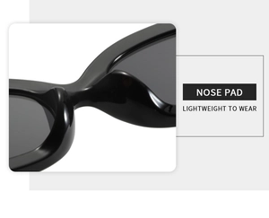 Detail shot of the integrated nose pad on lightweight black oval sunglasses for comfort