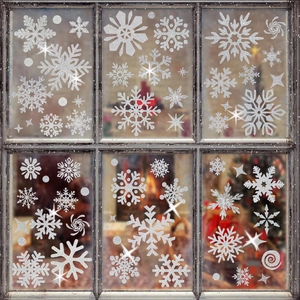 Sparkling white snowflake window decals on glass panes for Christmas home decoration