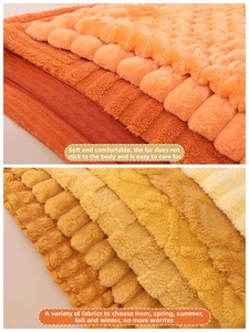 Detail of plush heart pillow fabric showing soft coral and corn fleece textures