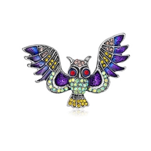 Detailed view of owl brooch with colorful rhinestones and elegant enamel inlay finish