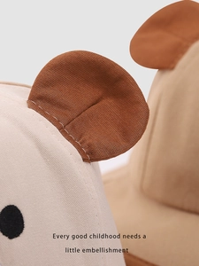 Detail of baby sun hat featuring beige and brown cotton fabric with cute 3D bear ears