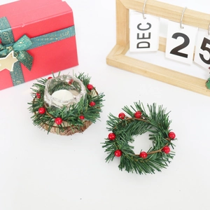 Christmas candle holder wreath with artificial holly berries and green pine needles