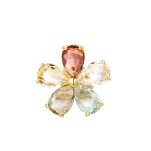 Macro detail of jewelry flower charm with multi-colored pear-cut gems and gold claws