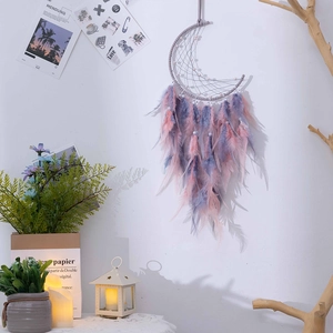 Handmade moon-shaped dream catcher with pink and purple feathers and beads