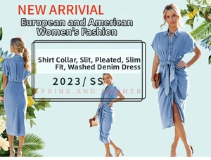 Detail of shirt collar and pleated waist design on washed light blue denim midi dress