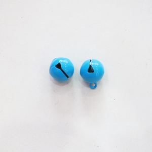 Macro detail of two 14mm candy-colored blue metal bells for pet collars and keychains