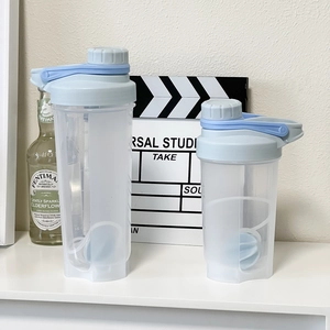 Close-up of two blue shaker bottles with screw lids and carrying handles in two sizes