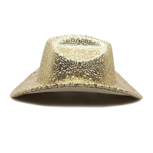 Macro shot of shimmering gold sequins on a wide-brimmed cowboy hat for stage costumes