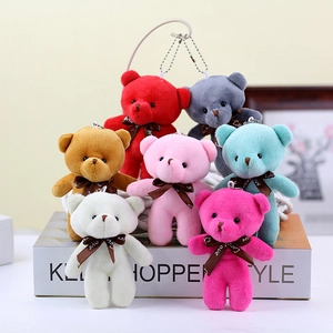 Seven colorful teddy bear plush keychains with Love ribbons in a decorative gift box