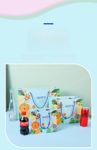 Three sizes of blue cartoon animal gift bags with woven handles and cute hand-drawn prints