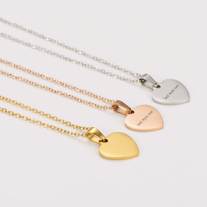 Three heart necklaces in silver, rose gold, and gold with best mom ever engraving