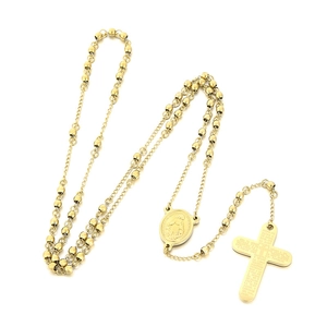 Golden rosary necklace featuring Mother Mary medal and engraved cross on white background