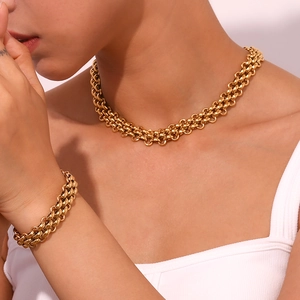 Detailed view of heavy chunky link chain necklace and bracelet set in 18K gold plating