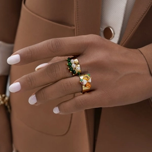 Wide gold-plated ring featuring colorful natural stones and pearls in bohemian style